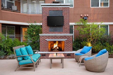 Outdoor poolside fireplace